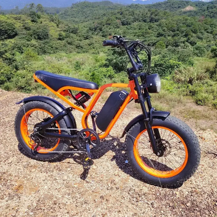 Boombike Bluvall SU8 moped ebike with 52V 1500W motor, showcasing off-road capability and vibrant orange design.